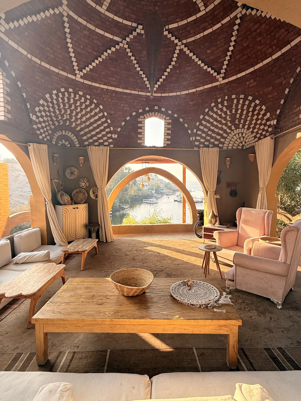Traditional Nubian domed interior at golden hour overlooking the Nile, Nubian Royals Sanctuary, Heisa Island, Aswan
